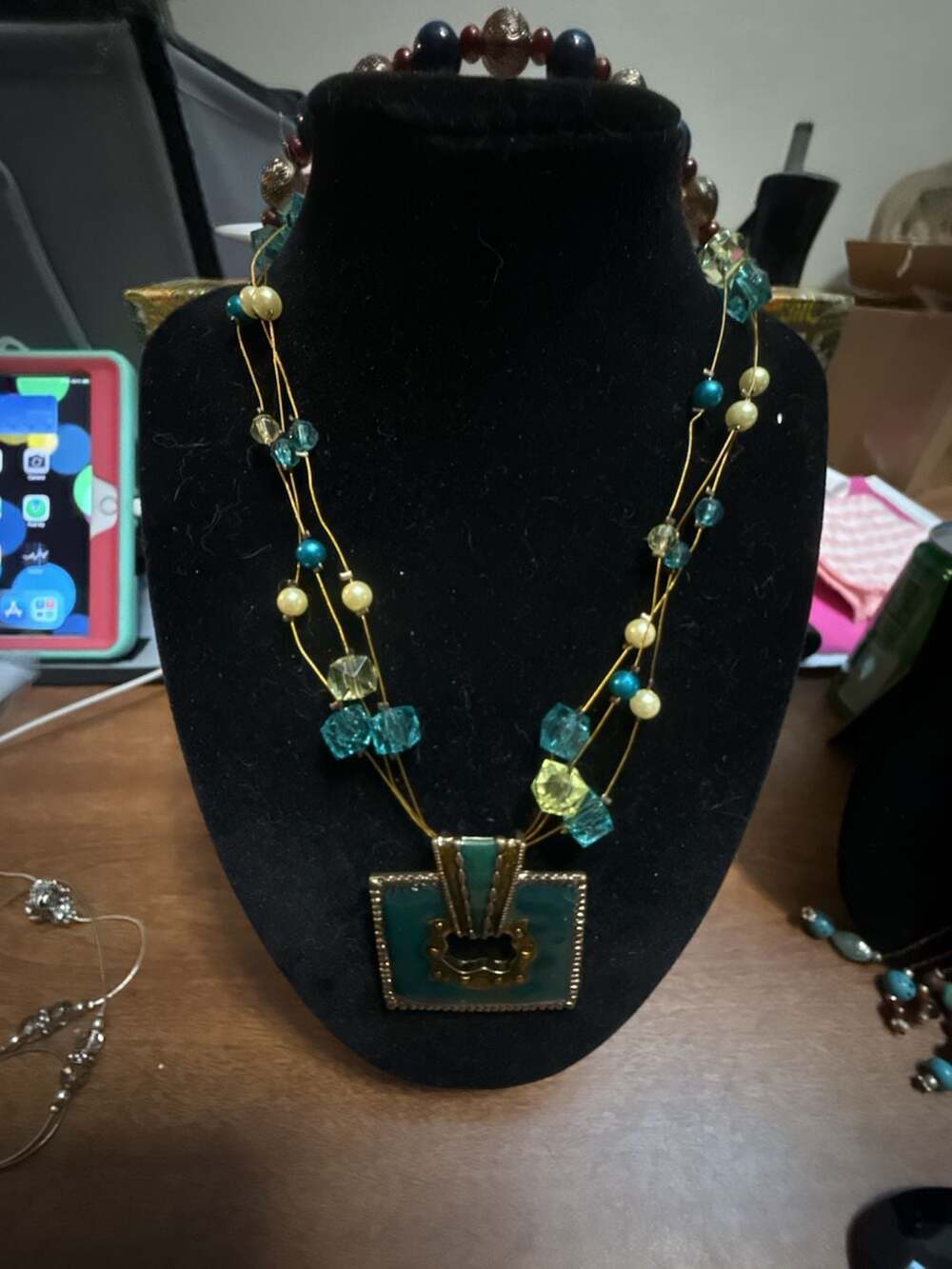 Multi Strand Glass Beaded Necklace with Turquoise Pendant and Gold Accents